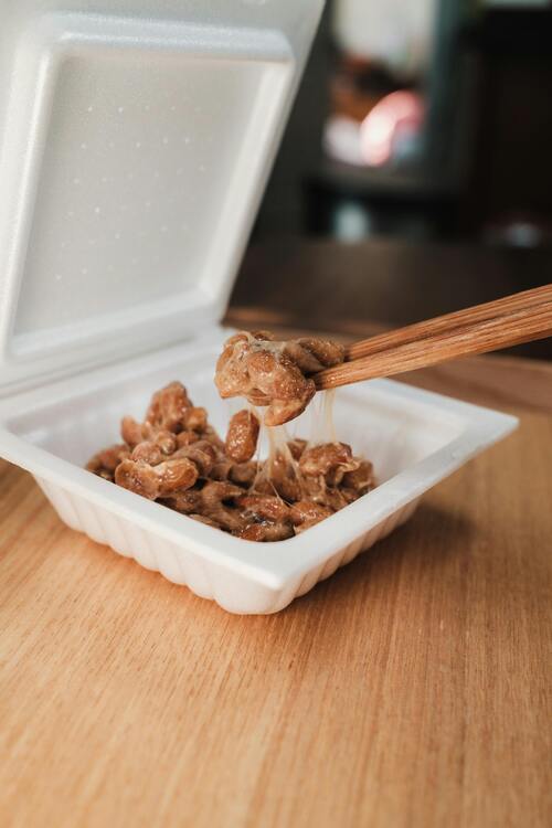 A split image showing gut-healthy foods on one side and processed foods to avoid on the other.