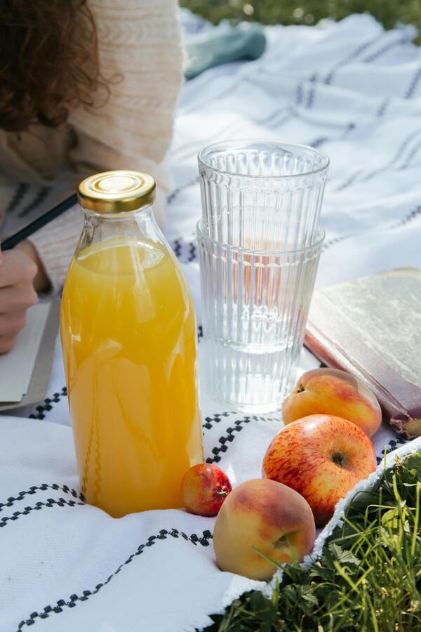 A spread of hydrating foods like watermelon, cucumber, strawberries, and celery.