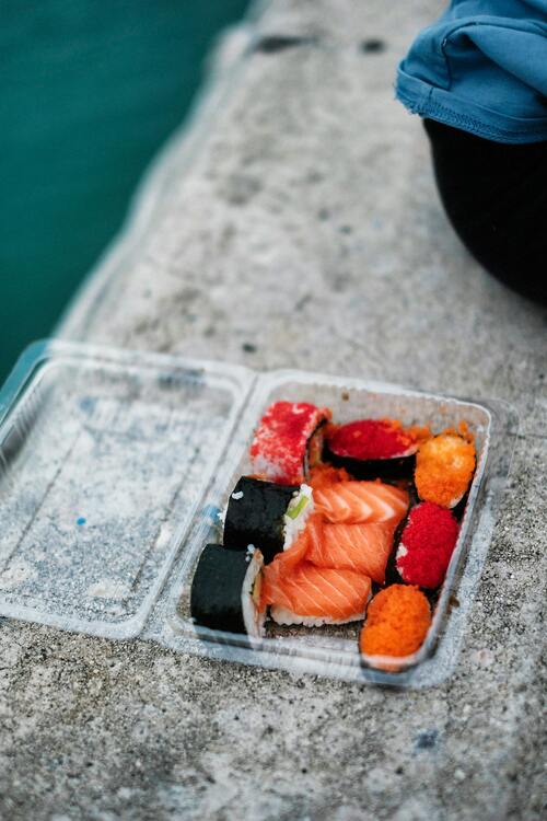 A healthy pre-workout meal of oatmeal with banana, berries, and nuts in a bowl.